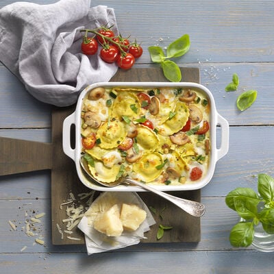 Ravioli amb ricotta i espinacs gratinats amb xampinyons